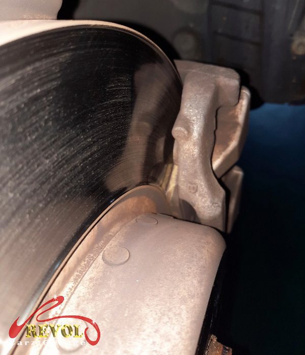The worn front pads removed, the discs measured and still serviceable.