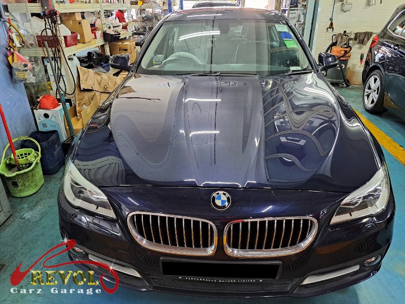 BMW 520i parked at the workshop for servicing.