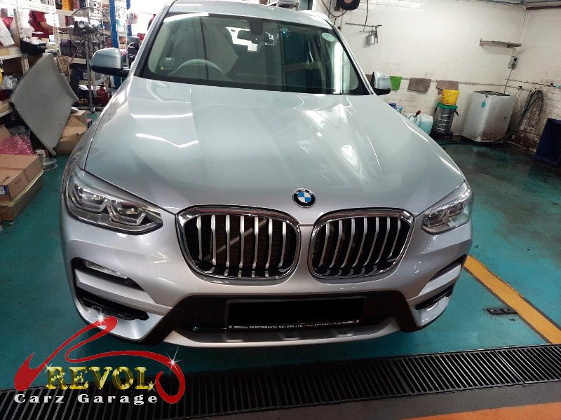 BMW X3 parked at the workshop, in for front brake inspection.