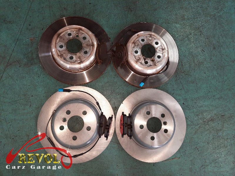 The new front brakes installed and the calipers serviced.