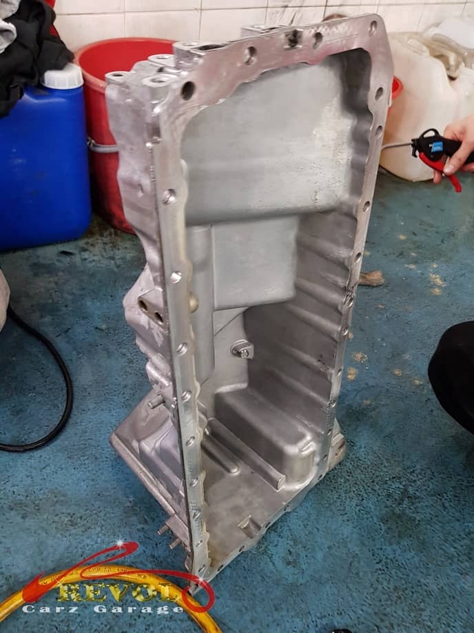 The BMW 535i oil sump off the car, the gasket renewed.