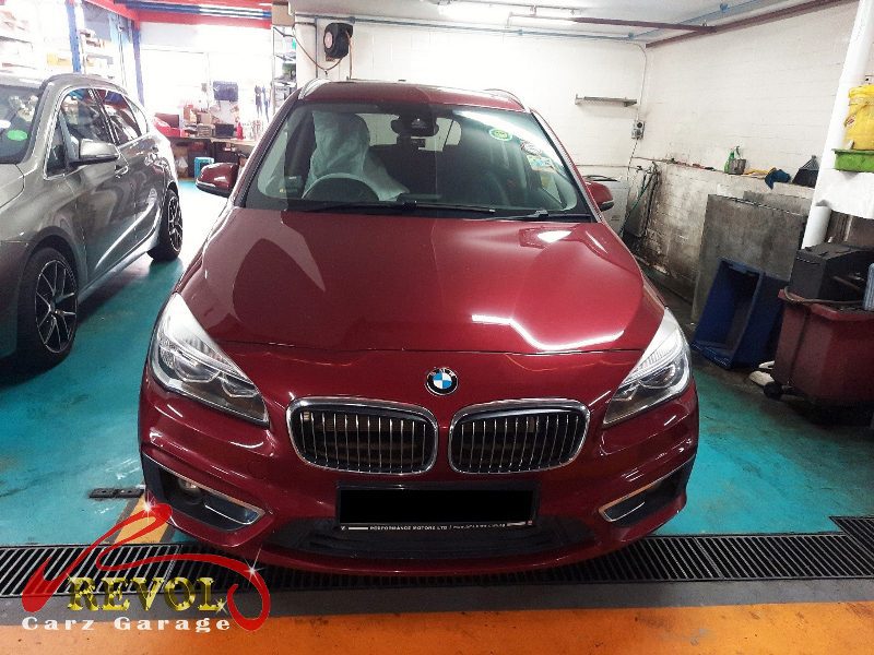 BMW 216d parked at the workshop for full maintenance servicing.