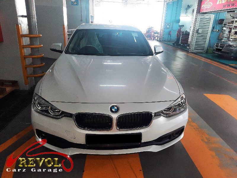 BMW 318i parked at the workshop for routine servicing.