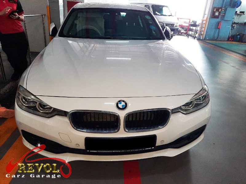 BMW 318i parked at the workshop, in for front brake inspection.