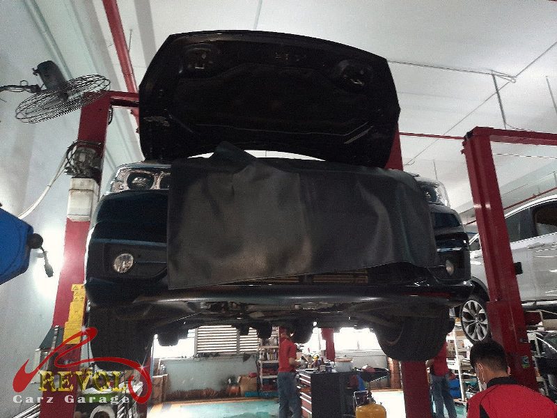 The transmission mount removed showing the play under load.