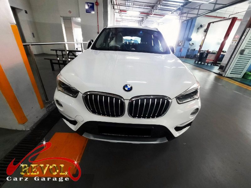 BMW X1 parked at the workshop, in for a starter motor diagnosis.