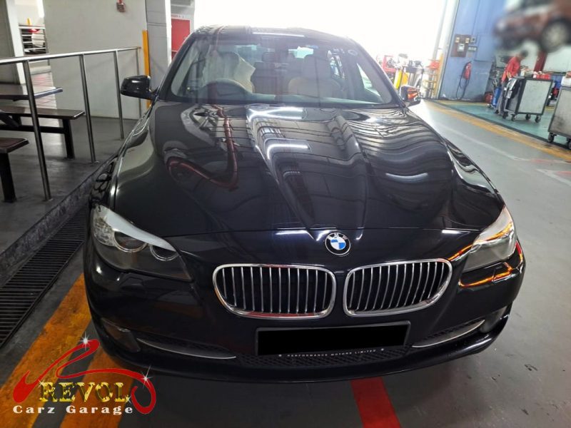 BMW 520i parked at the workshop, in for a coolant leak diagnosis.