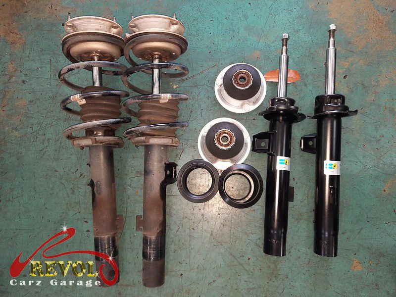 The new BMW-spec front struts and top mounts ready to fit.