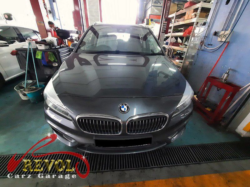 BMW 216d parked at the workshop for a service and front brake replacement.