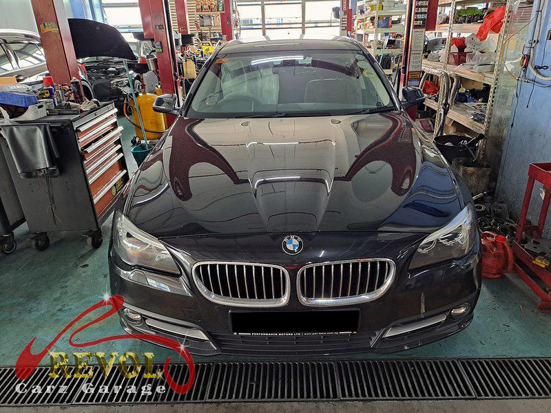BMW 520i parked at the workshop, in for a coolant warning diagnosis.