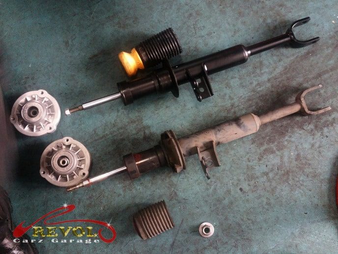 The front shock absorber found leaking oil and losing pressure.