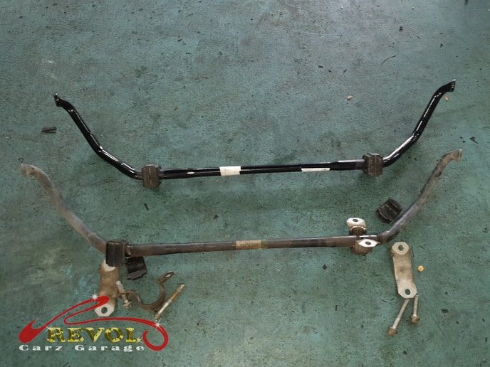 The new and the used front shock absorber set side by side.