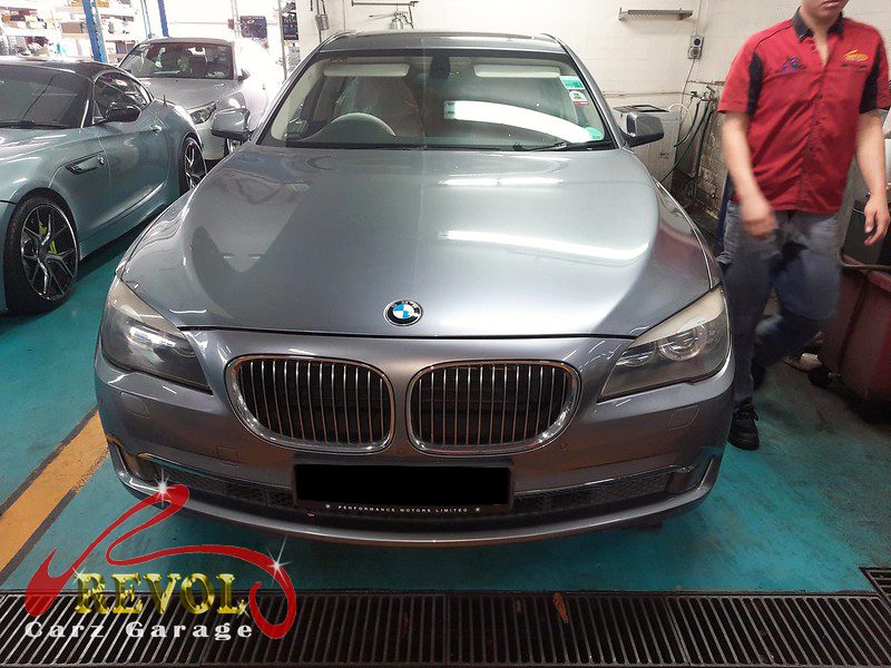 BMW 730i parked at the workshop, in for a valve cover oil leak diagnosis.