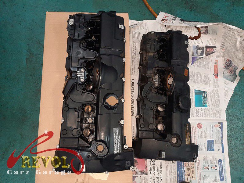 The new BMW-spec valve cover with fresh gasket ready to fit.