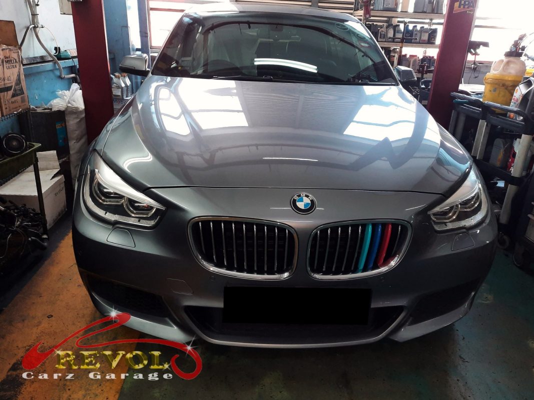 BMW 528i parked at the workshop, in for front shock absorber inspection.
