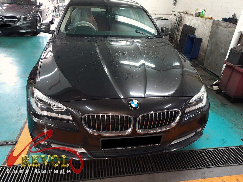 BMW 520i parked at the workshop for a drive belt service.