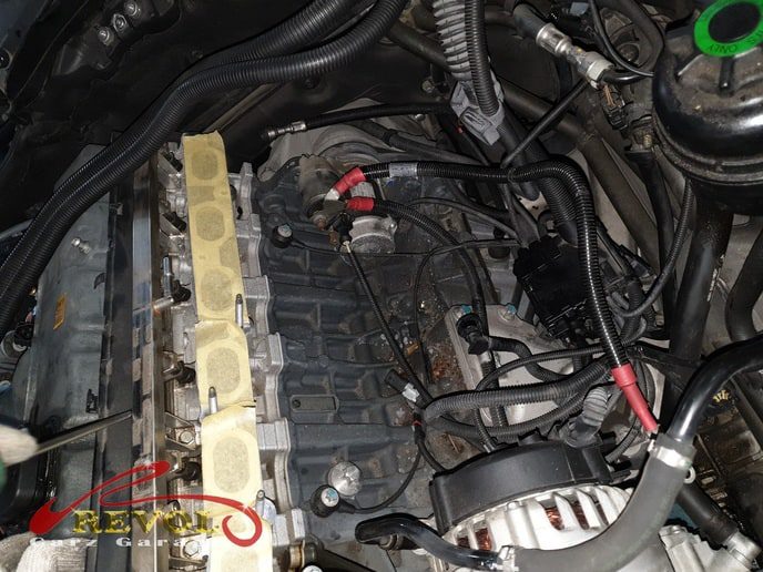 BMW at the workshop, in for a service and white exhaust smoke.