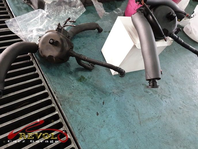 The BMW checked for the white smoke, the fault narrowed down to the oil separator.
