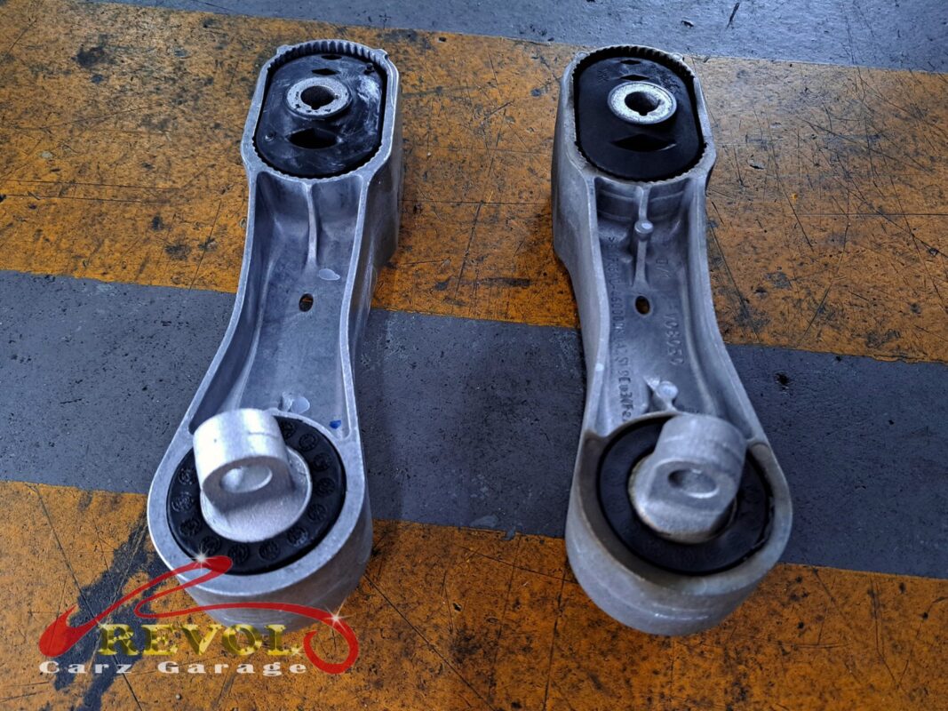 The drivetrain settled on the new mounts and aligned in the bay.