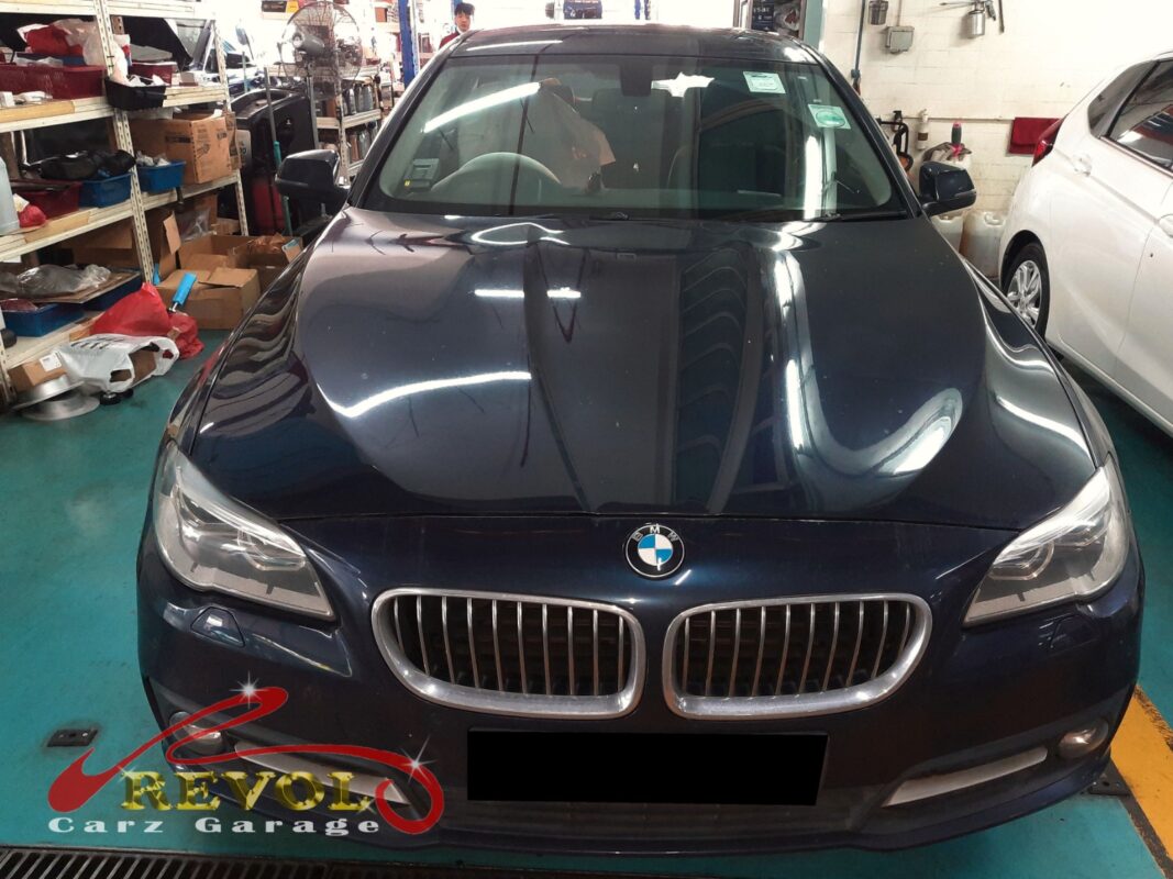 BMW 520i parked at the workshop, in for propeller shaft mounting inspection.