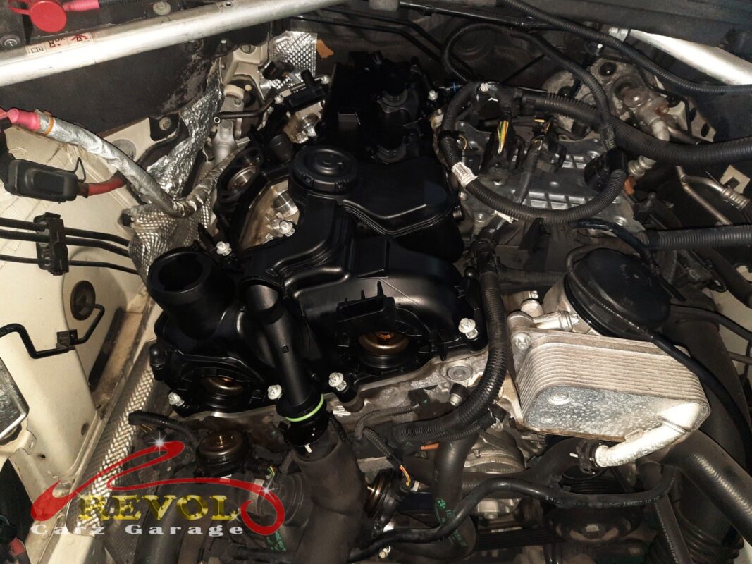 The new valve cover installed and the coils reseated.