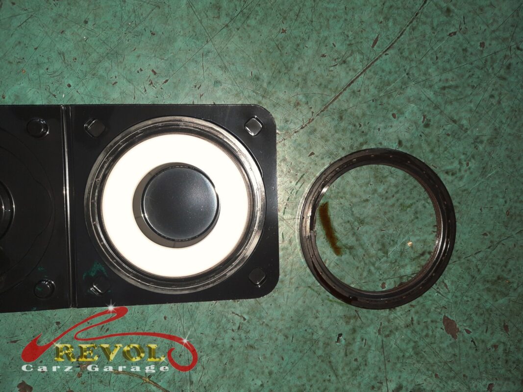 The flywheel and gearbox reinstalled and the area cleaned up.