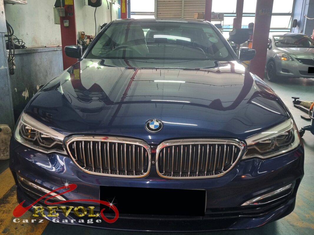 BMW 520i parked at the workshop, in for cooling system inspection.