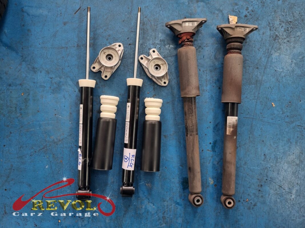 The new BMW-spec rear shocks and top mounts ready to fit.