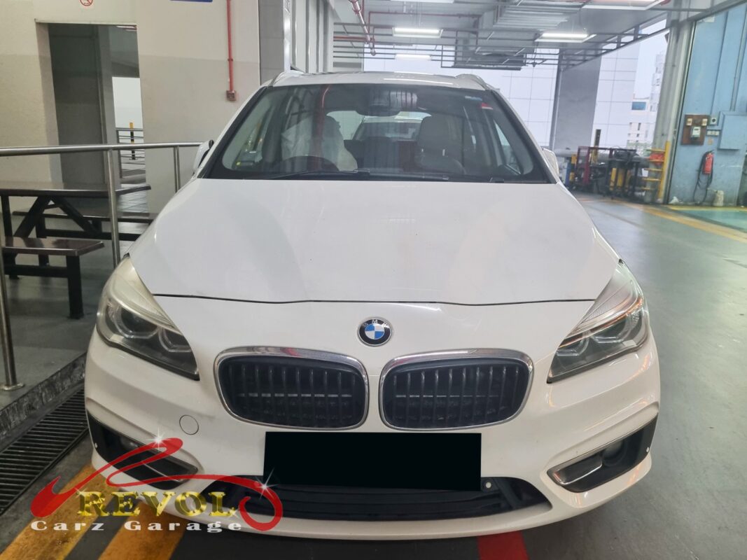 BMW 216d parked at the workshop, in for driveshaft cover repair.