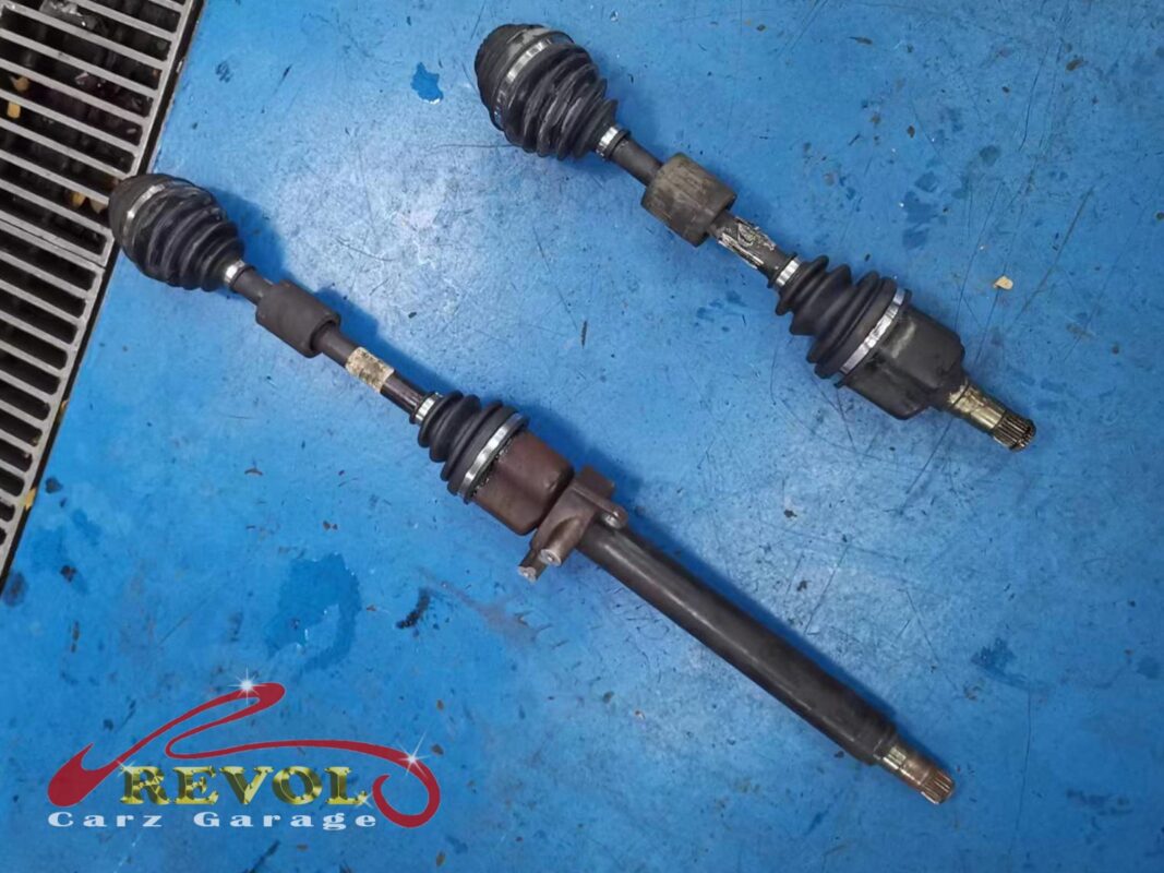The driveshaft out of the car, the joint resealed with a new boot and fresh grease.