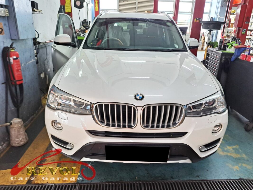 BMW X3 parked at the workshop, in for cooling system inspection.