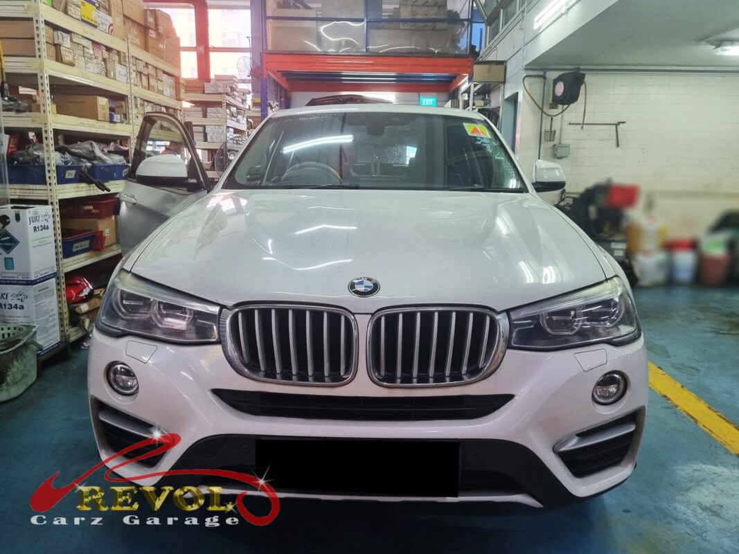 BMW X4 parked at the workshop, in for brake inspection.