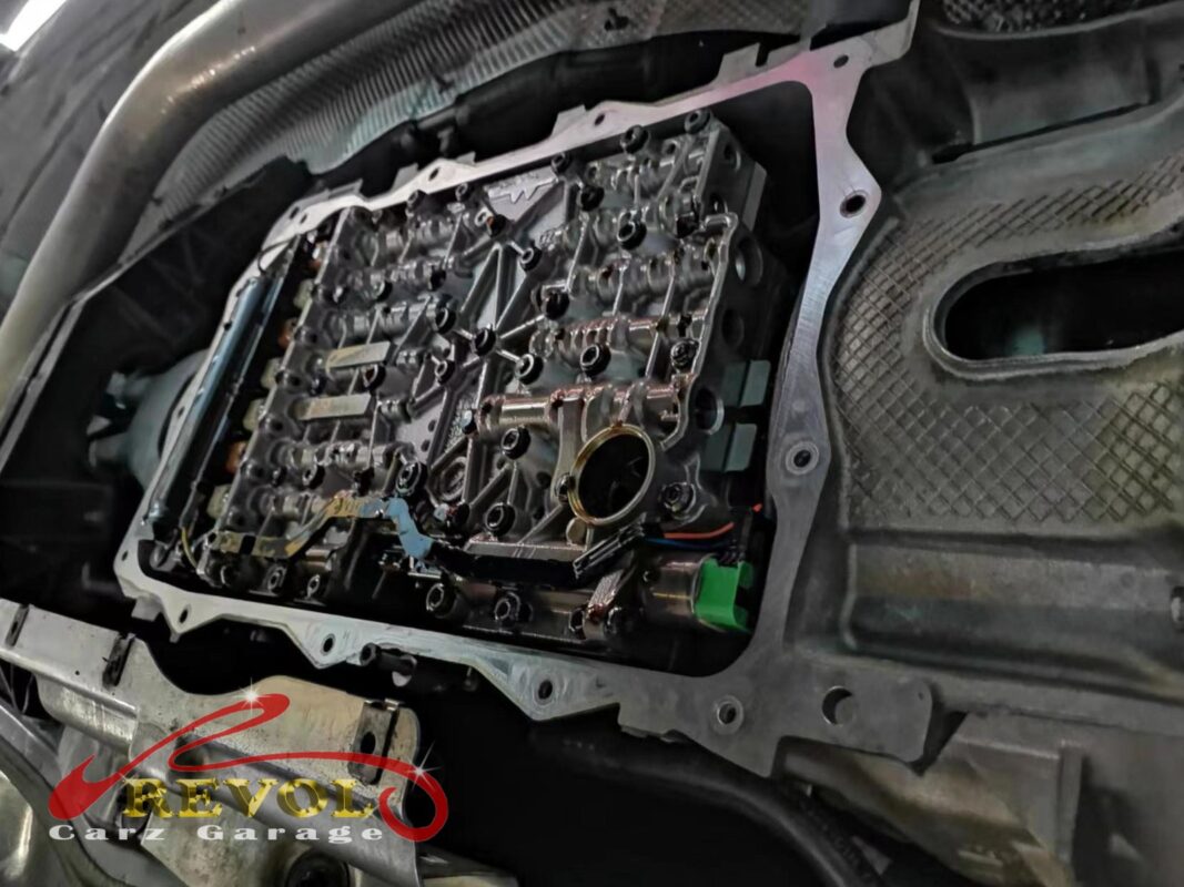 The old transmission pan and filter unit with the tired fluid that came out.