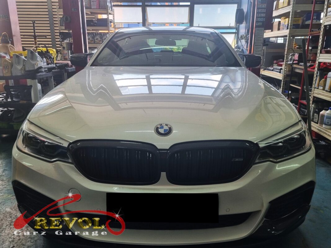 BMW 520i parked at the workshop, in for cooling system inspection.
