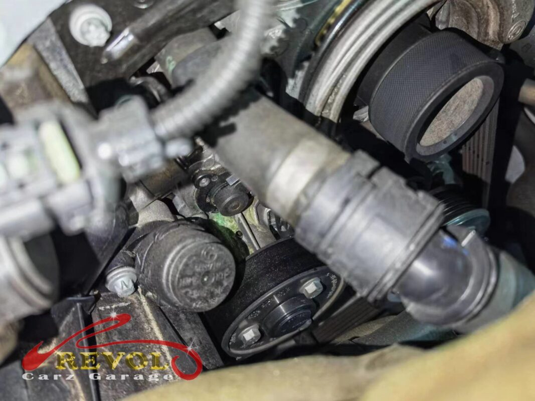 The old cracked water pump housing removed from the engine.