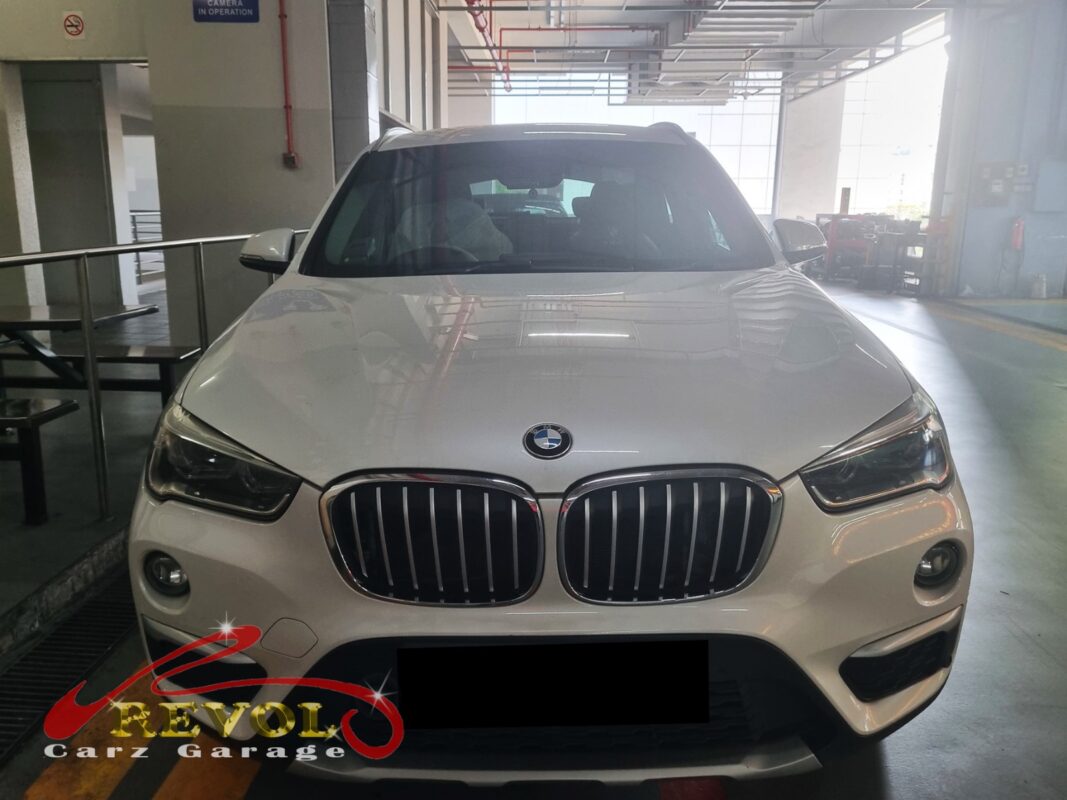 BMW X1 parked at the workshop, in for oil filter housing leak inspection.