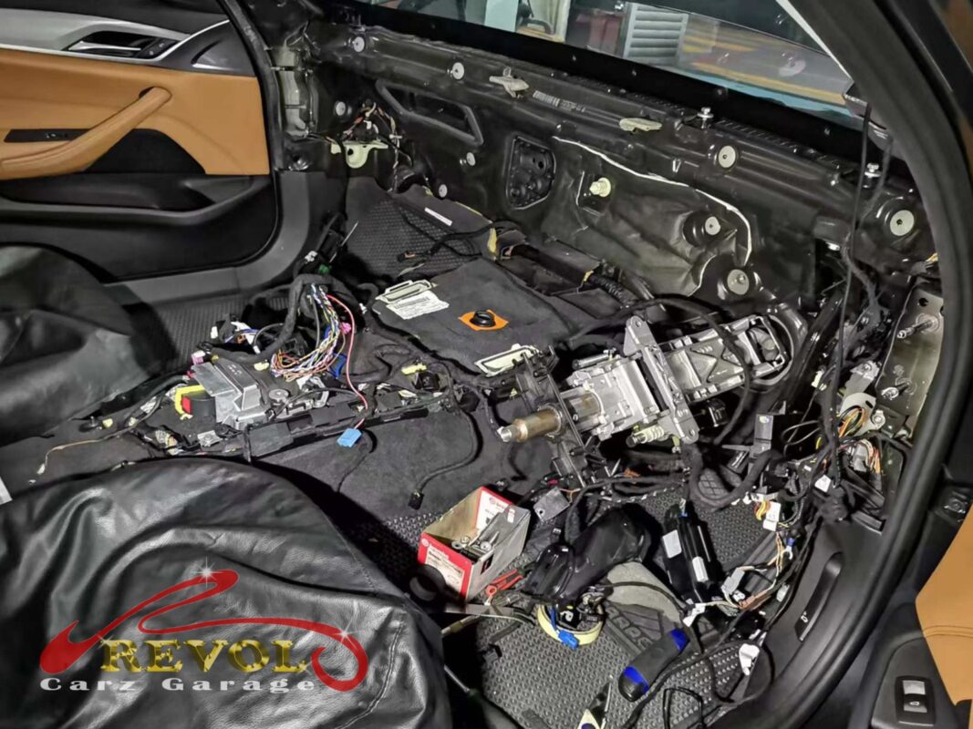 The AC system pressure-checked on the BMW 530i during the leak hunt.