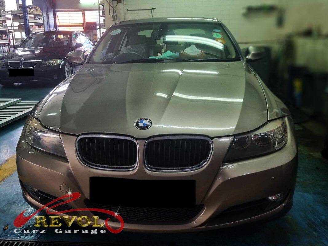 BMW 318i parked at the workshop, in for aircon cooling coil inspection.