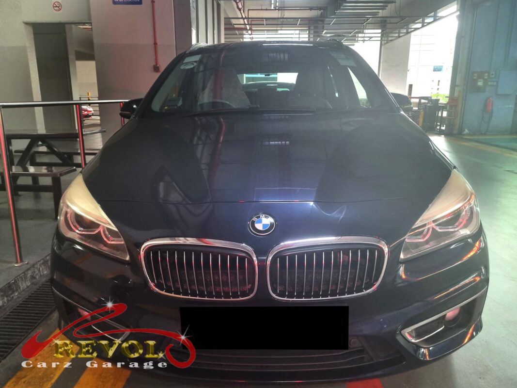BMW 216d parked at the workshop, in for cooling system inspection.