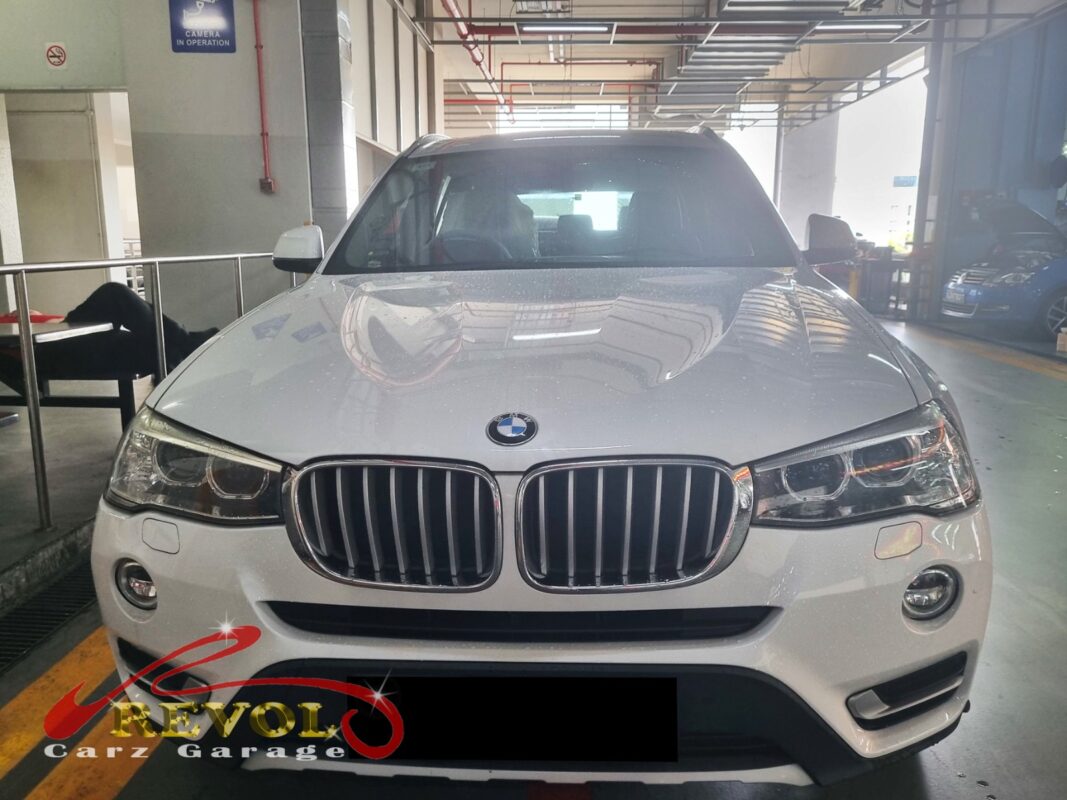 BMW X3 parked at the workshop, in for valve cover oil leak inspection.