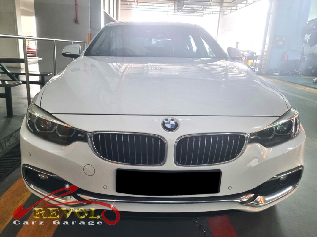 BMW 420i on the lift for its scheduled maintenance.