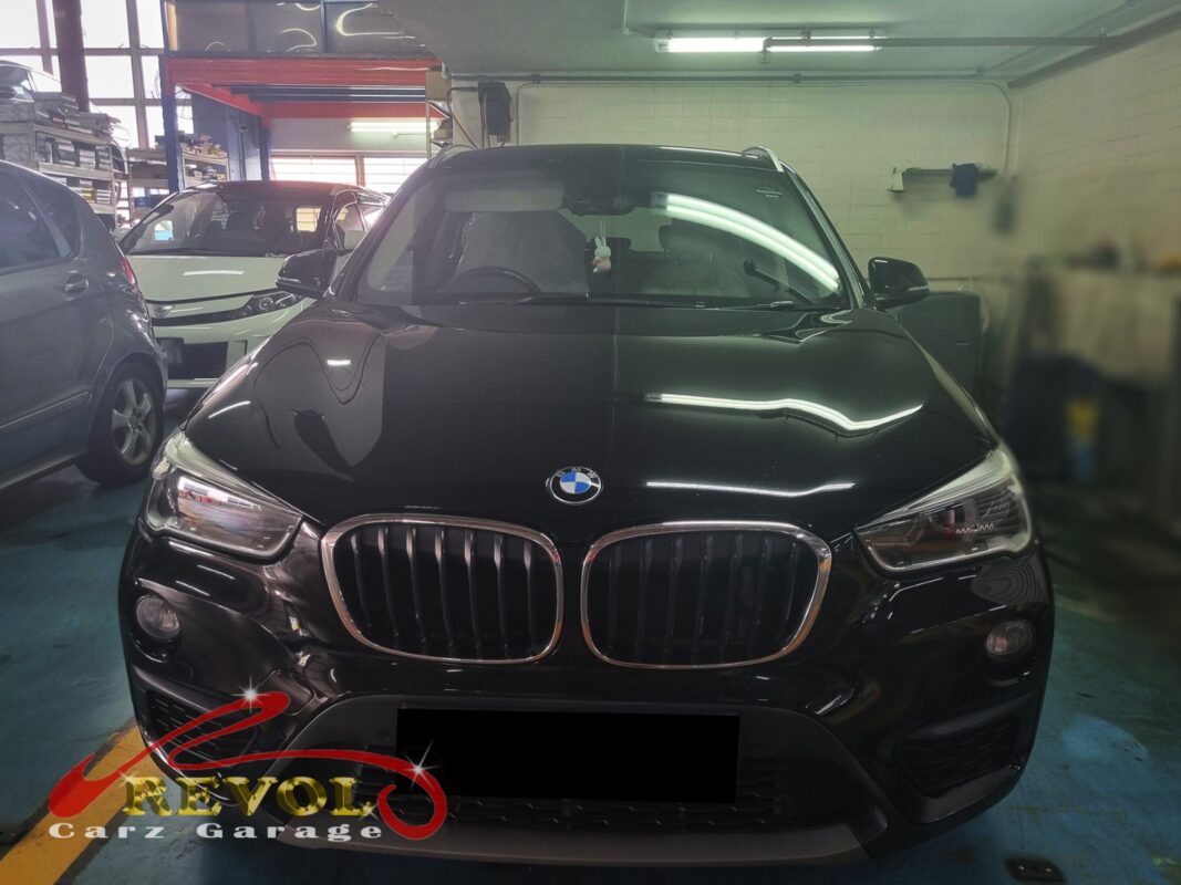 BMW X1 on the lift for its scheduled maintenance.