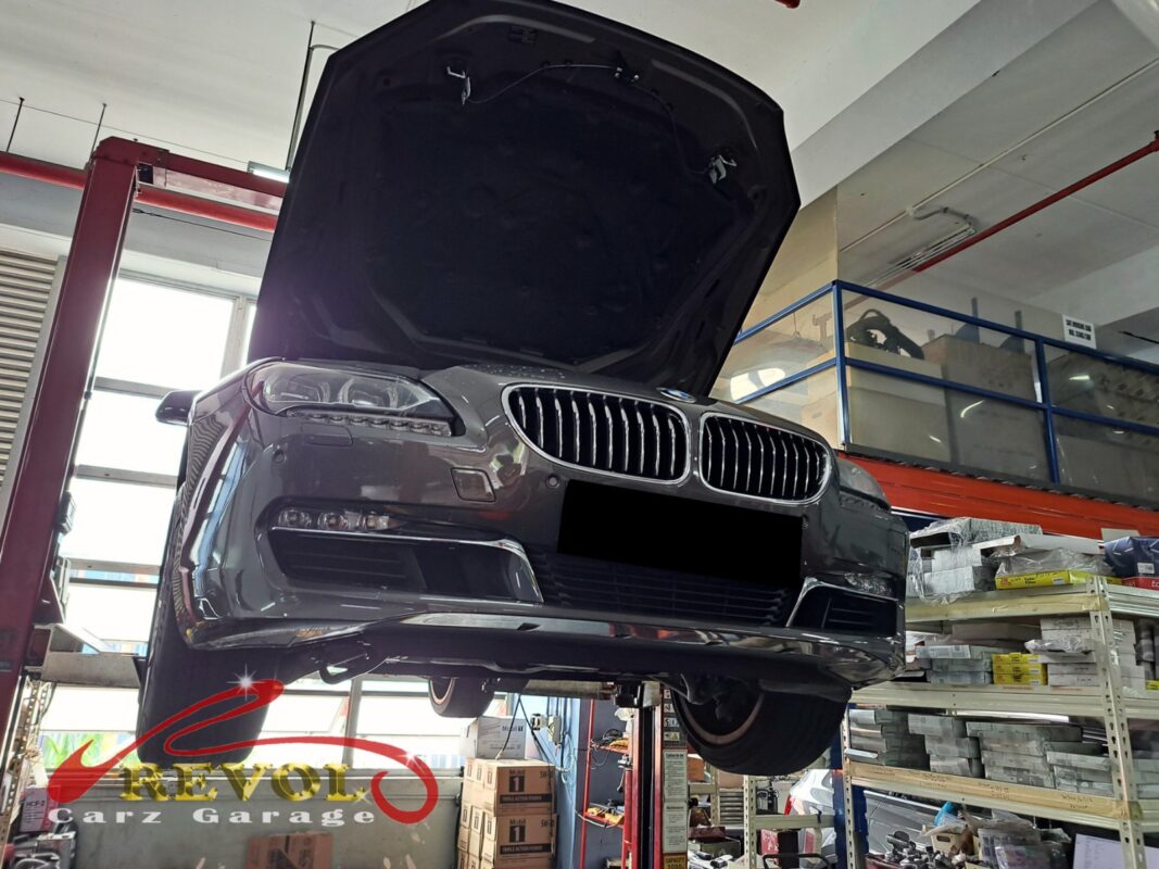 The BMW 640i up on the two-post lift, in for the coolant pump job.