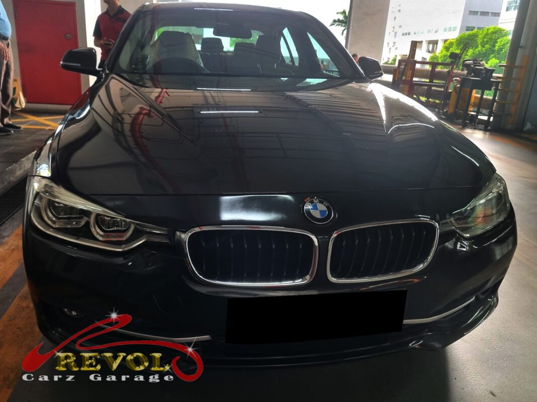 BMW 318i on the lift for control and lower arm replacement.