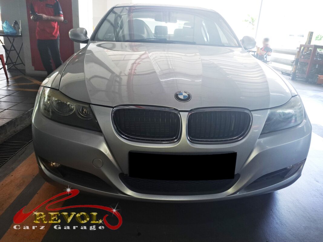 BMW 318i in the workshop for starter motor replacement.