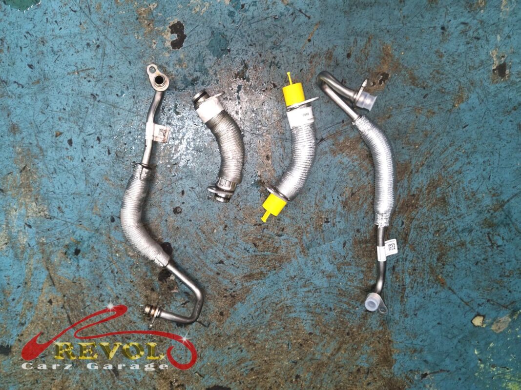 New BMW-spec turbo and fresh gaskets ready for installation.
