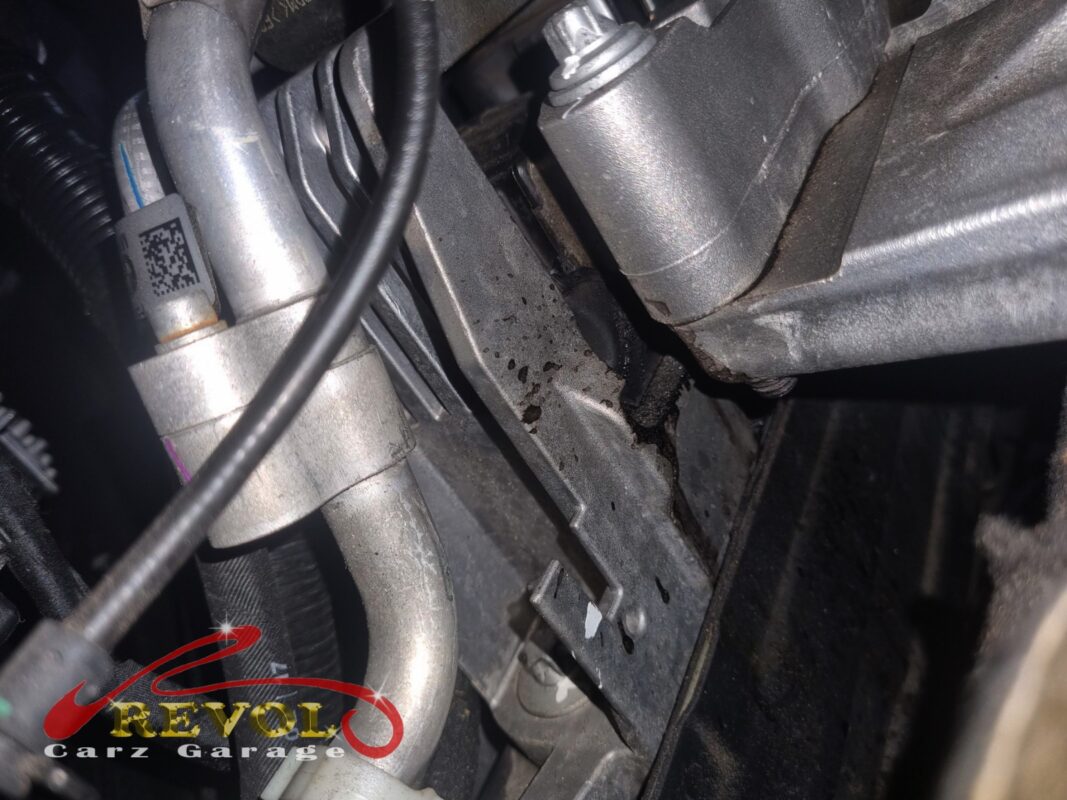 Oil seepage and grime around one of the engine mounts in the bay, the first clear sign the set was on its way out.