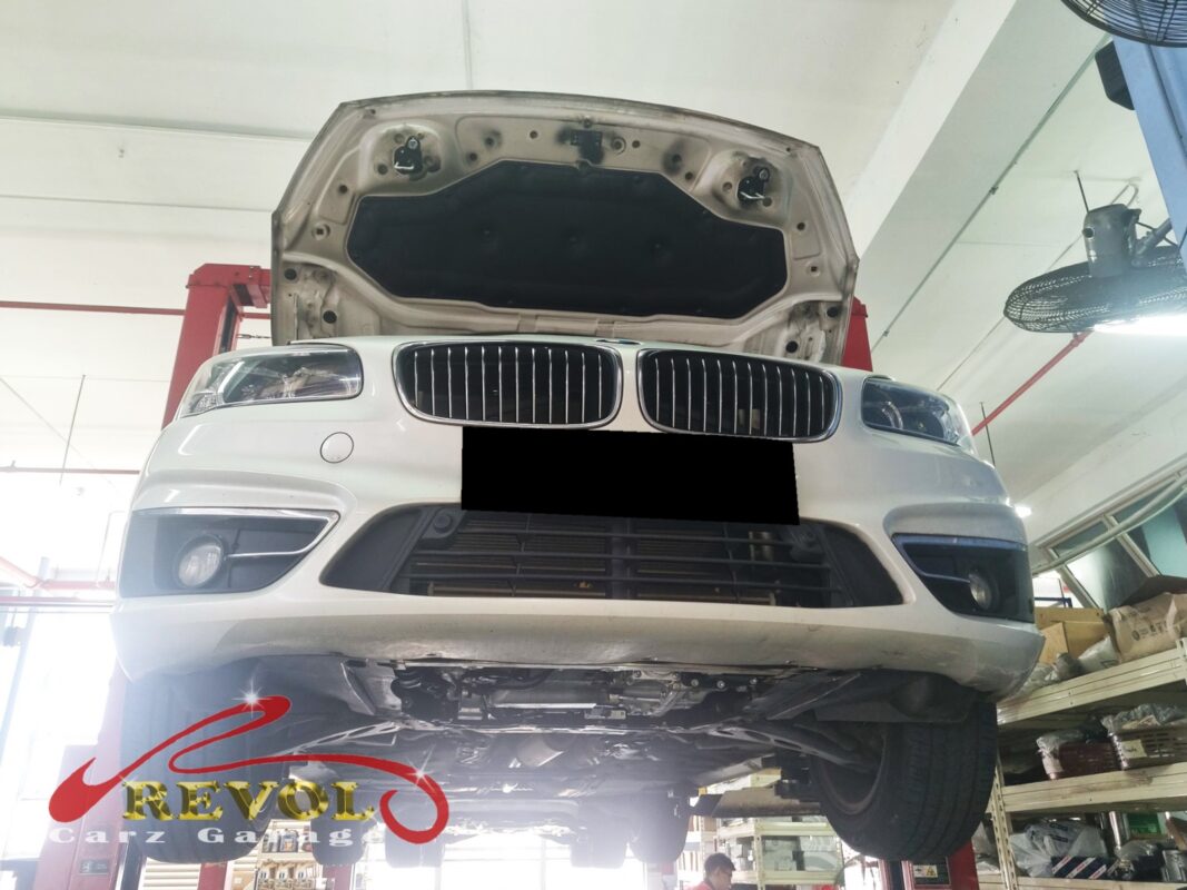 The 216i up on the two-post lift, in for the front linkage job.