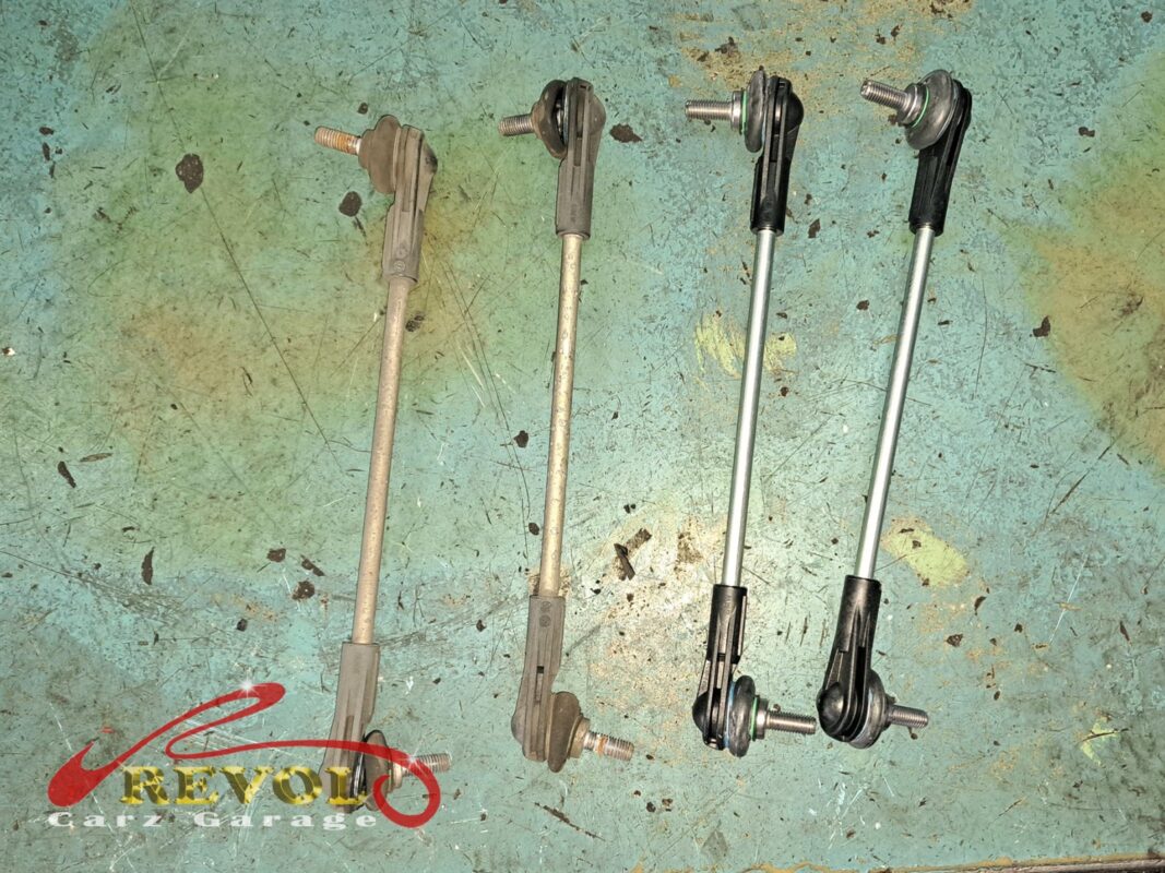 The pair of old drop links (left) beside the new BMW-spec replacements (right).