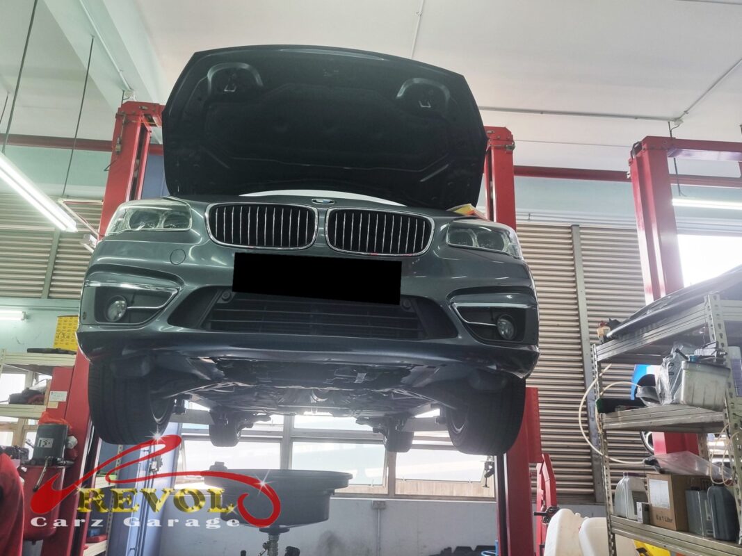 The 216d up on the two-post lift, in for the front lower arms.
